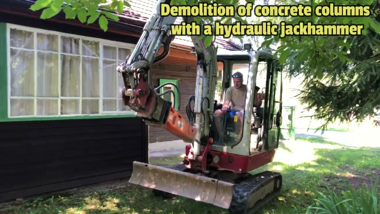 I'm demolishing the concrete pillars of an old barn with an excavator and a jackhammer.