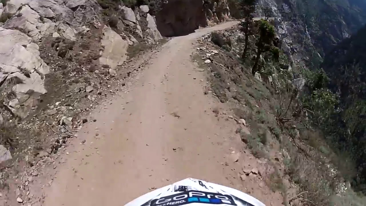 WORLD'S MOST DANGEROUS RIDE on edge of cliff. HIMALAYAS
