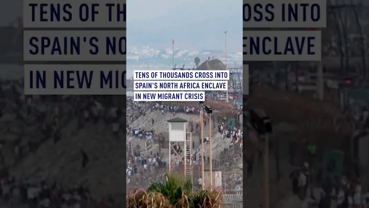 Tens of thousands cross into Spain's north Africa enclave in new migrant crisis