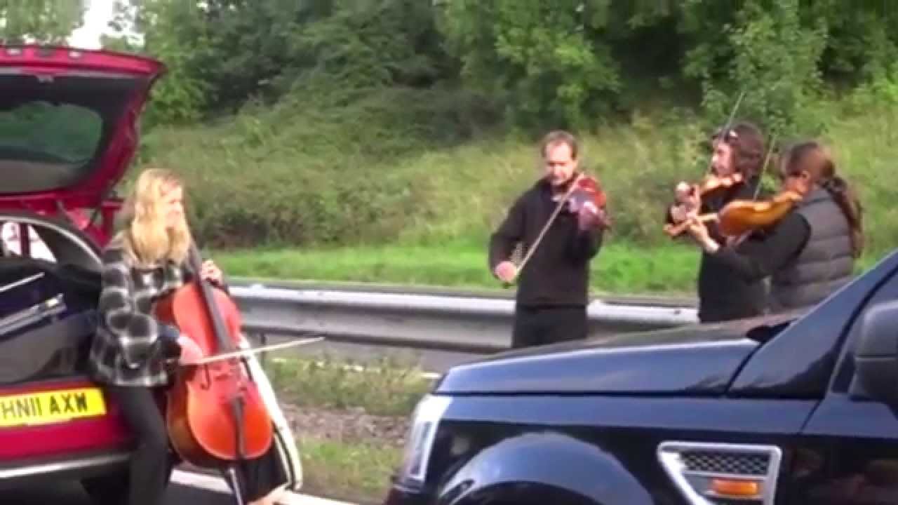 String quartet play on M5 on Somerset and Devon border, near Taunton
