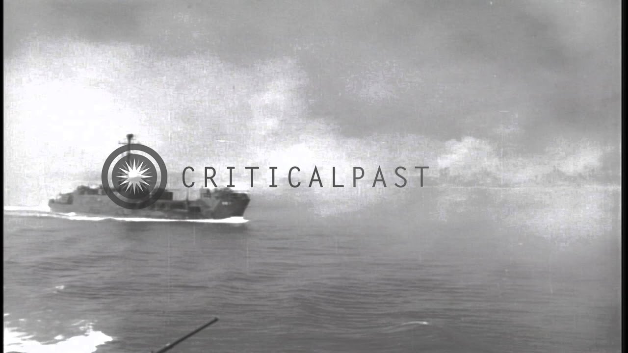 United States Marines aboard a landing craft and guns fired from ships underway a...HD Stock Footage