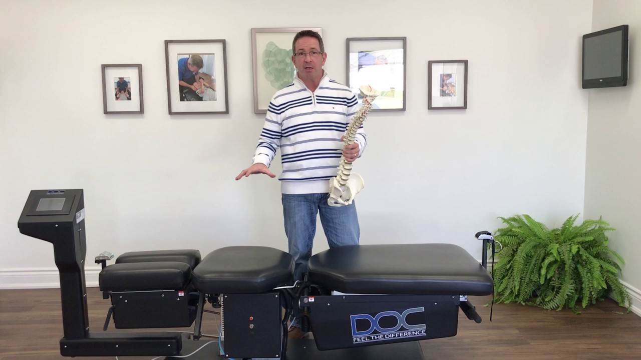 Burlington Chiropractor demonstrates how their decompression tables can help SCOLIOSIS!