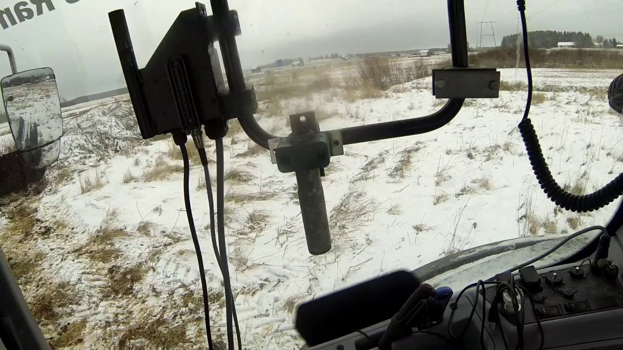 Valtra T214d driving sediment from the water plant