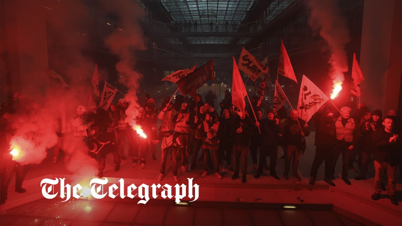 French protesters with flares storm BlackRock offices in Paris