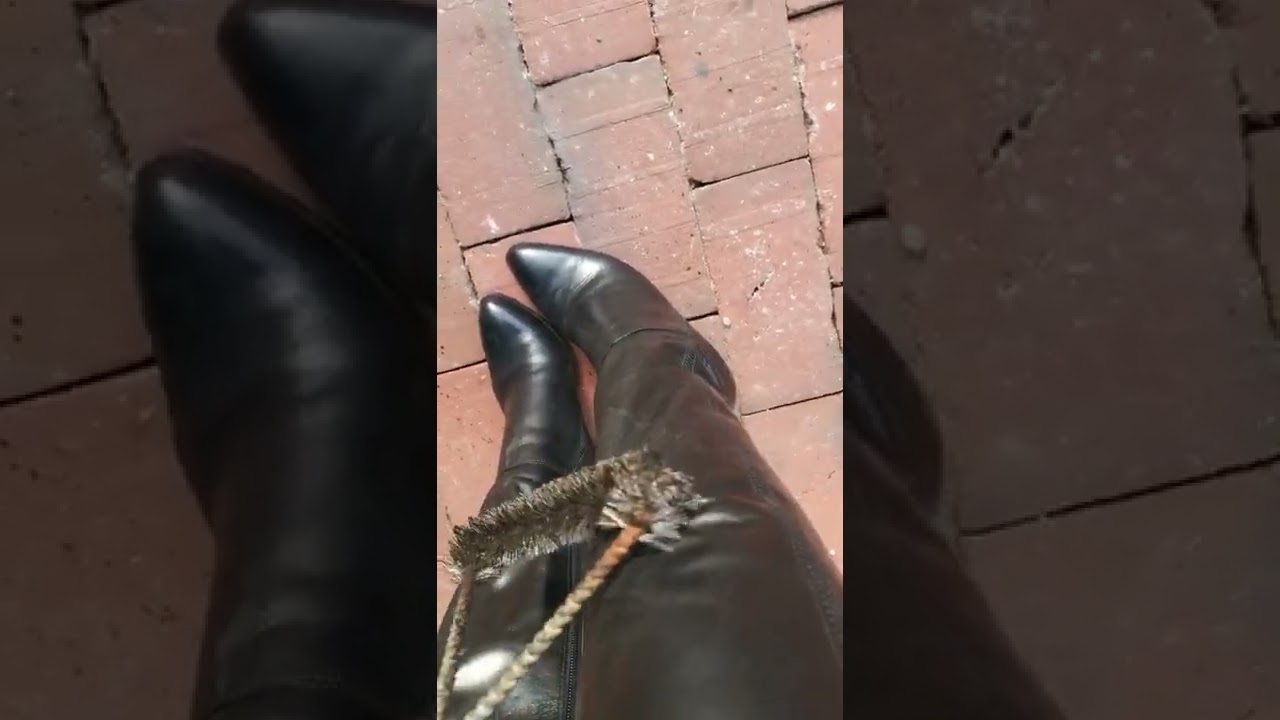 abused black leather boots