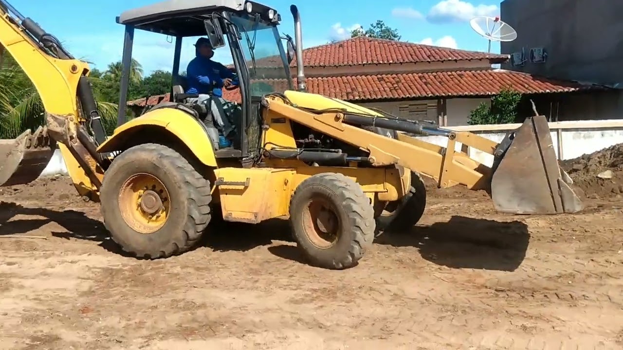 Retroescavadeira new Holland trabalhando!