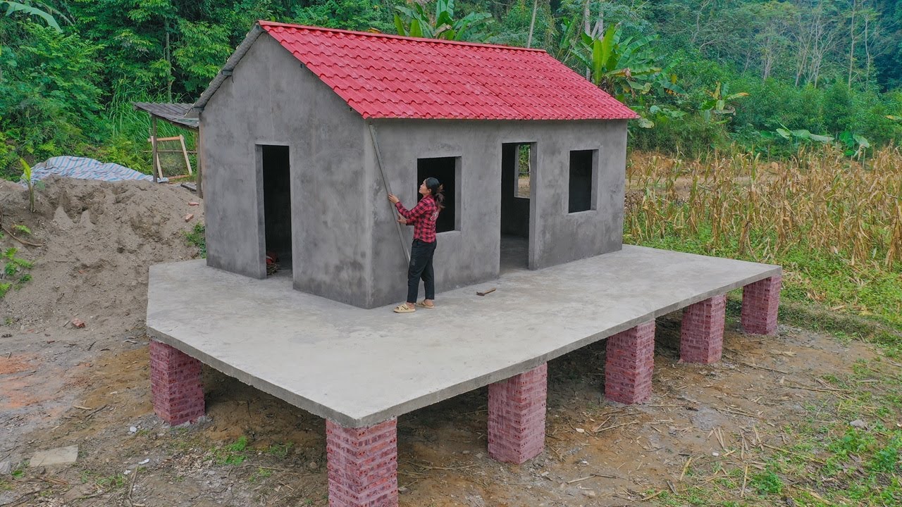 Welding iron frames and trusses - Roofing with red insulated corrugated iron sheets