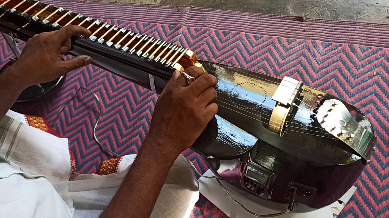 Playing madhura veena (jack wood).