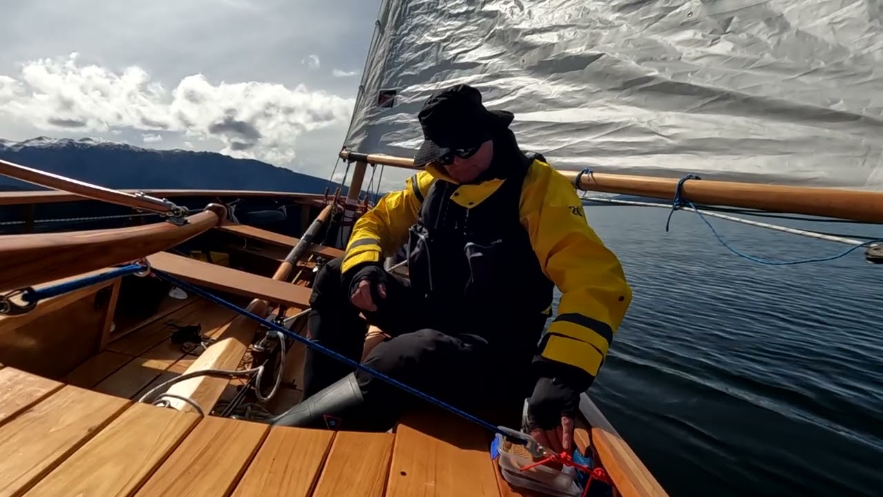 Tilly.  Ilur cruising dinghy. Grabbing a window in the weather.