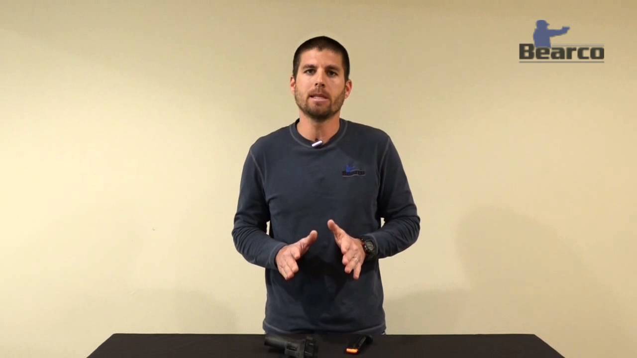 Magazine insert sends slide forward on handgun