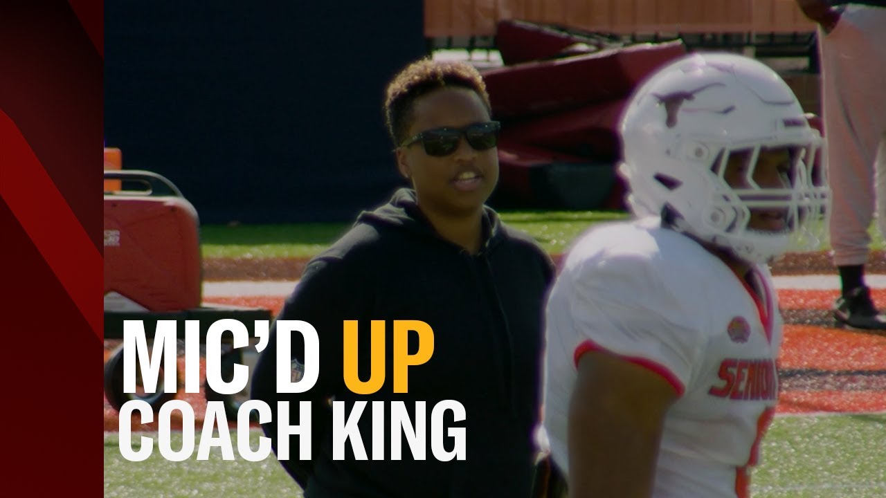 Wired for sound: Coach Jennifer King on the mic at the 2023 Senior Bowl