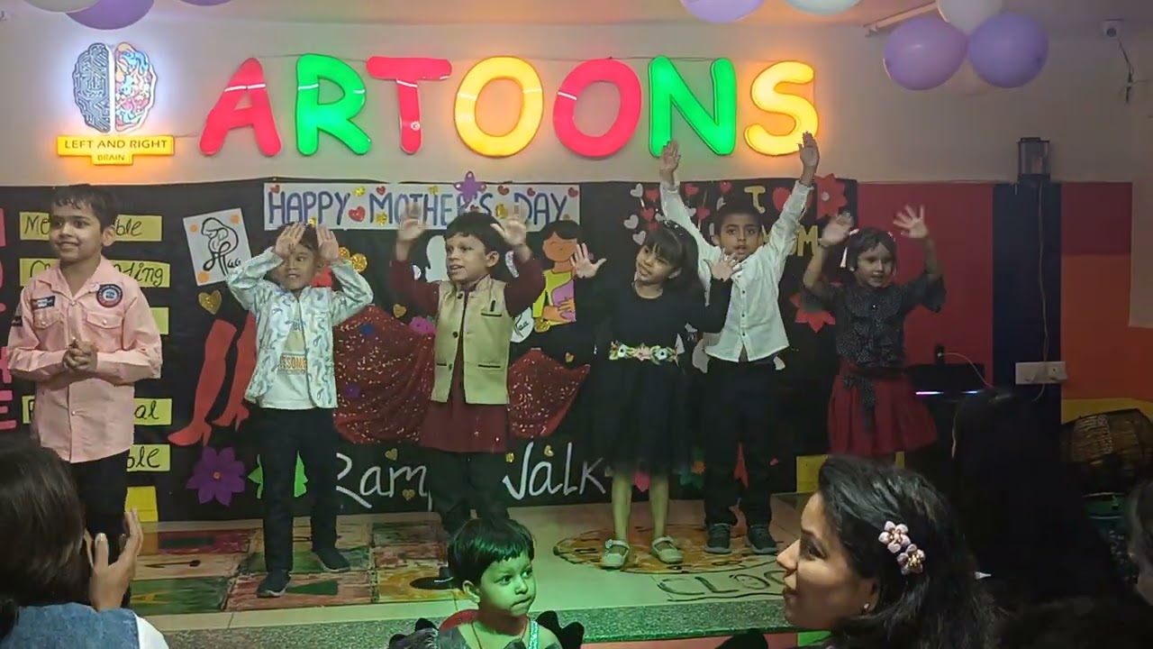 Little kids dancing for mothers
