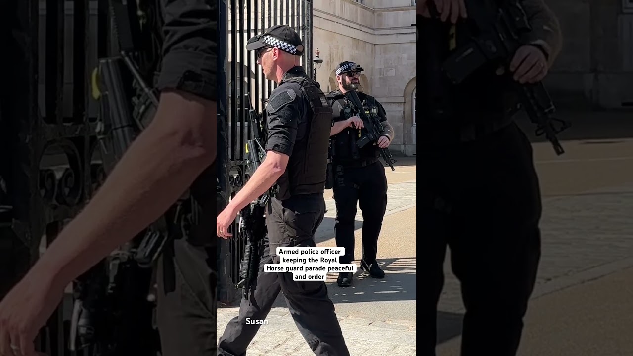 Armed police officers keeping the Royal horse guard parade safe  