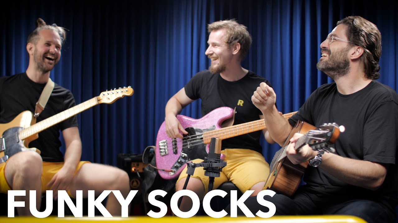 Playing acoustic guitar in a funk band