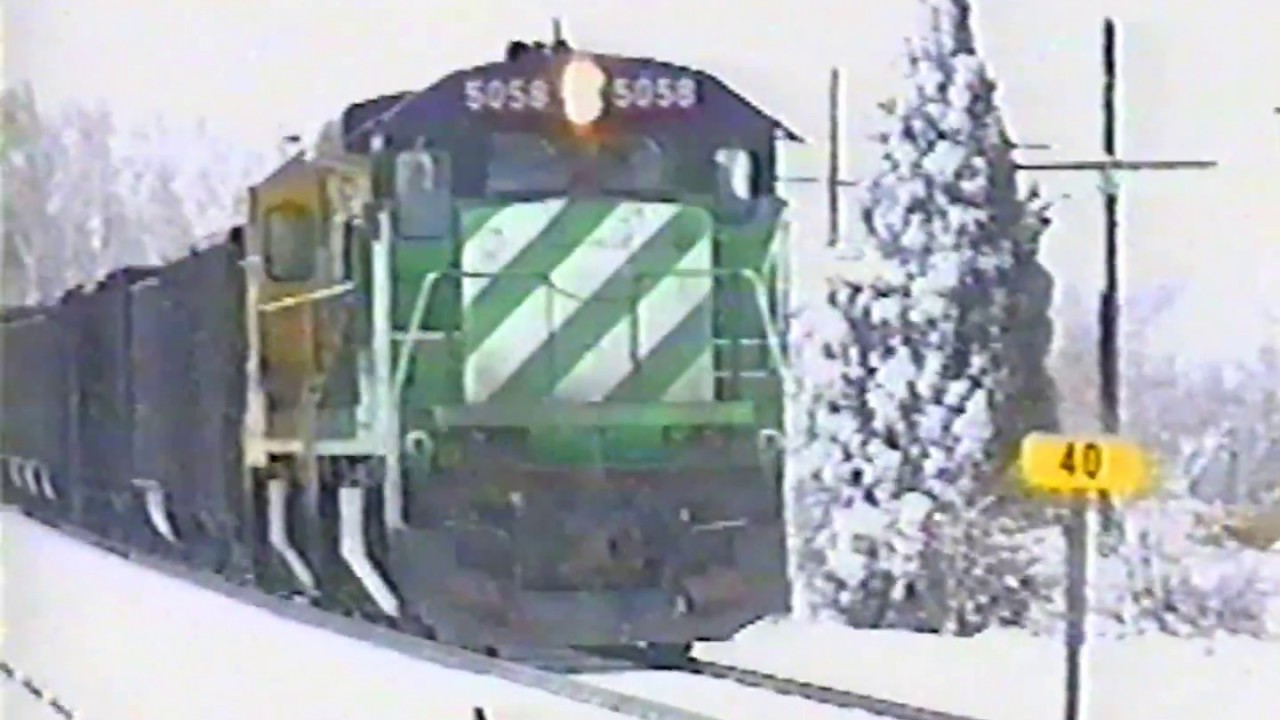 Burlington Northern coal train with C30-7 pushers with pacing March, 1994