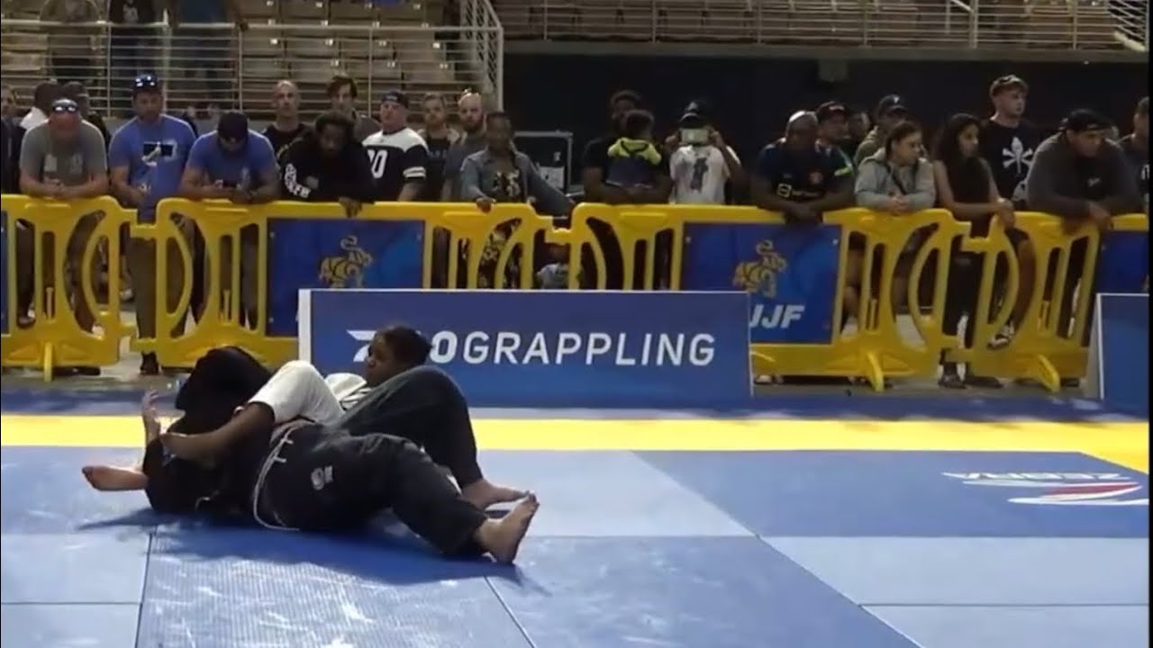 Black girl finishes opponent with bow and arrow choke