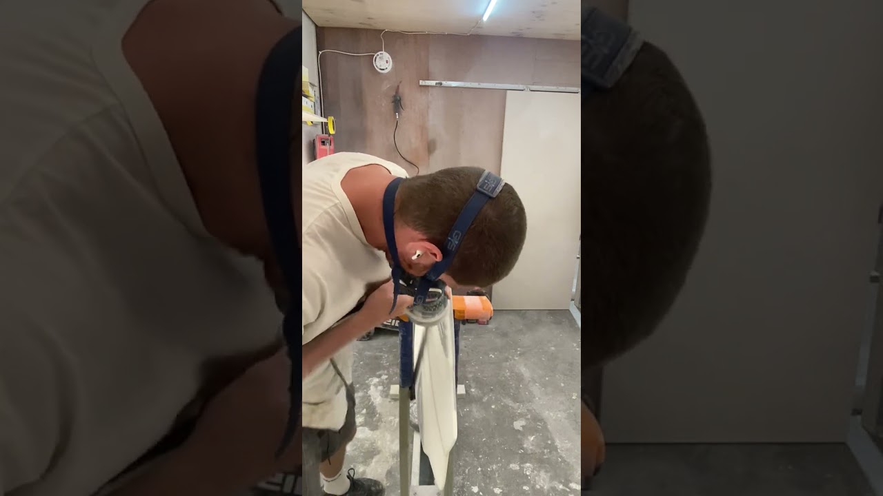 SURFBOARD DING REPAIR. Orbital sanding channel bottom.