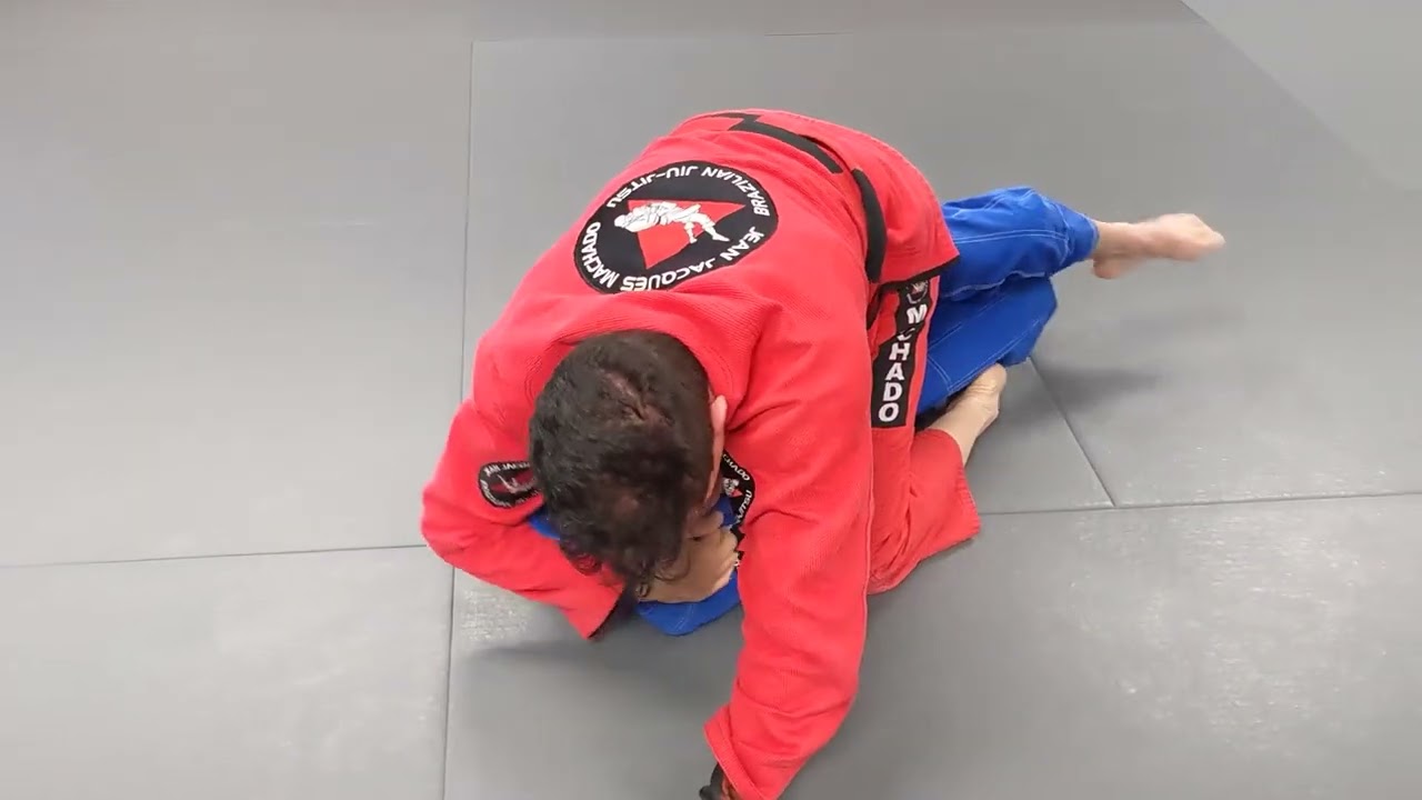 Jean Jacques Machado Rolling with Purple Belt Student