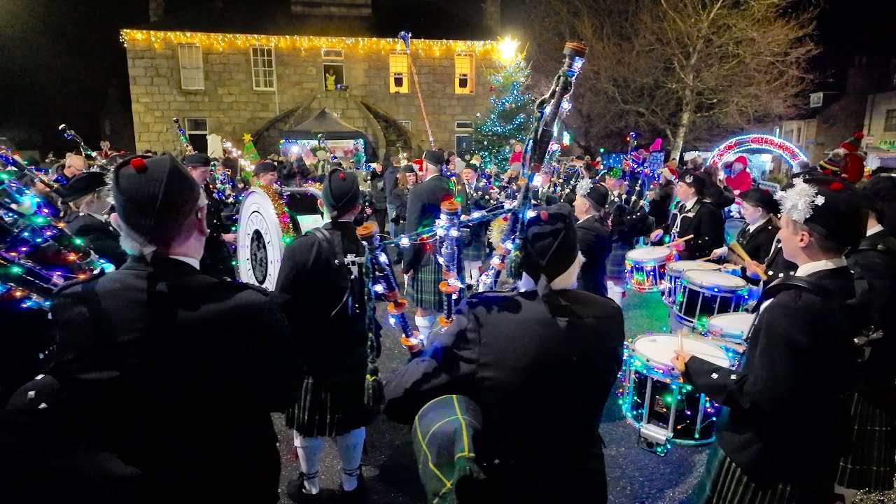 Jingle Bells played by a festive Kintore Pipe Band in Aberdeenshire, Scotland, with Christmas lights