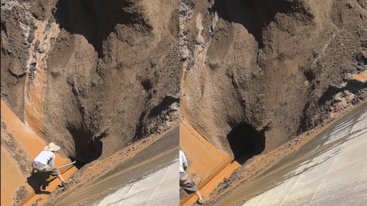 The iron ore on the cargo ship is too wet, making unloading very difficult.