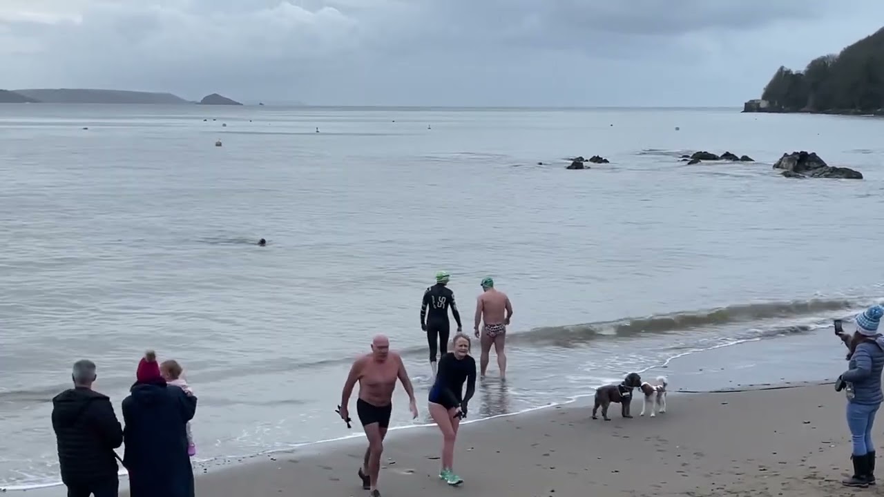 Brave swimmers take to the water for traditional New Year&rsquo;s Day sea swim in Cawsand, Cornwall