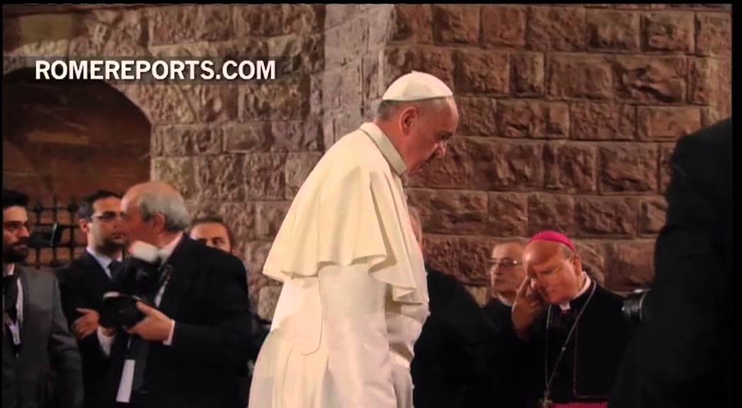 Pope prays before the tomb of St. Francis