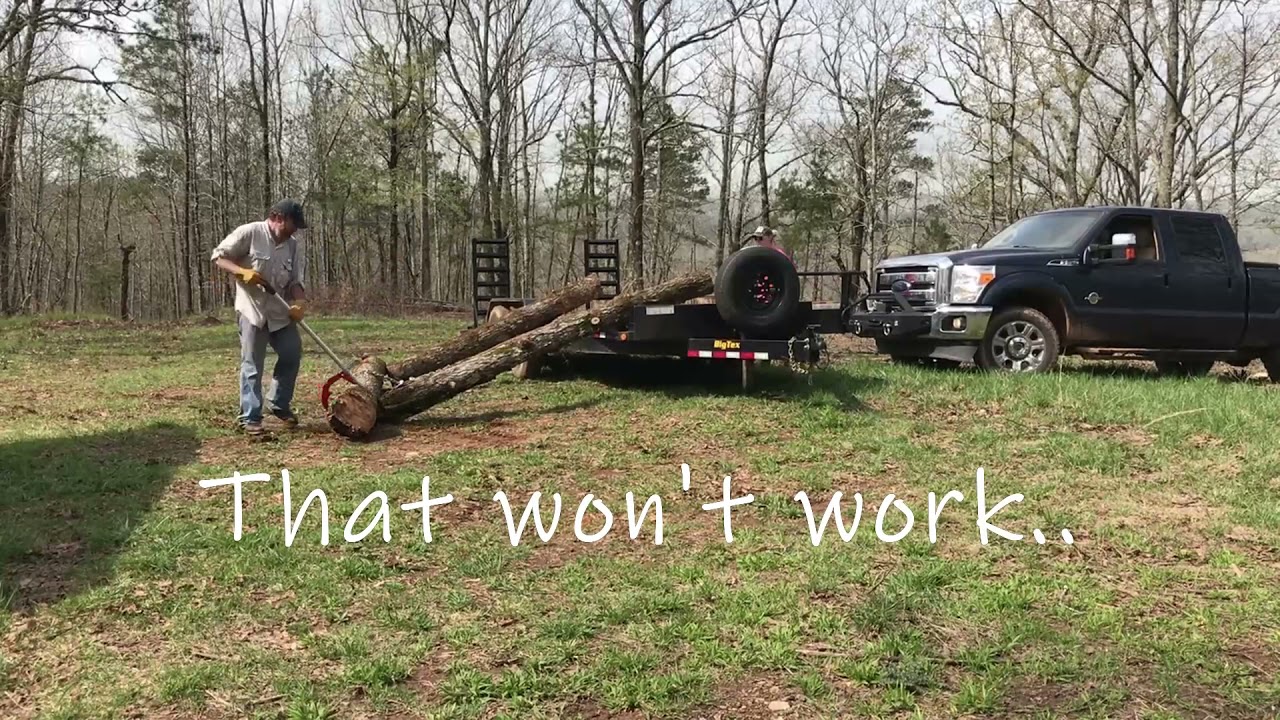 #20 Loading logs on a trailer with a winch