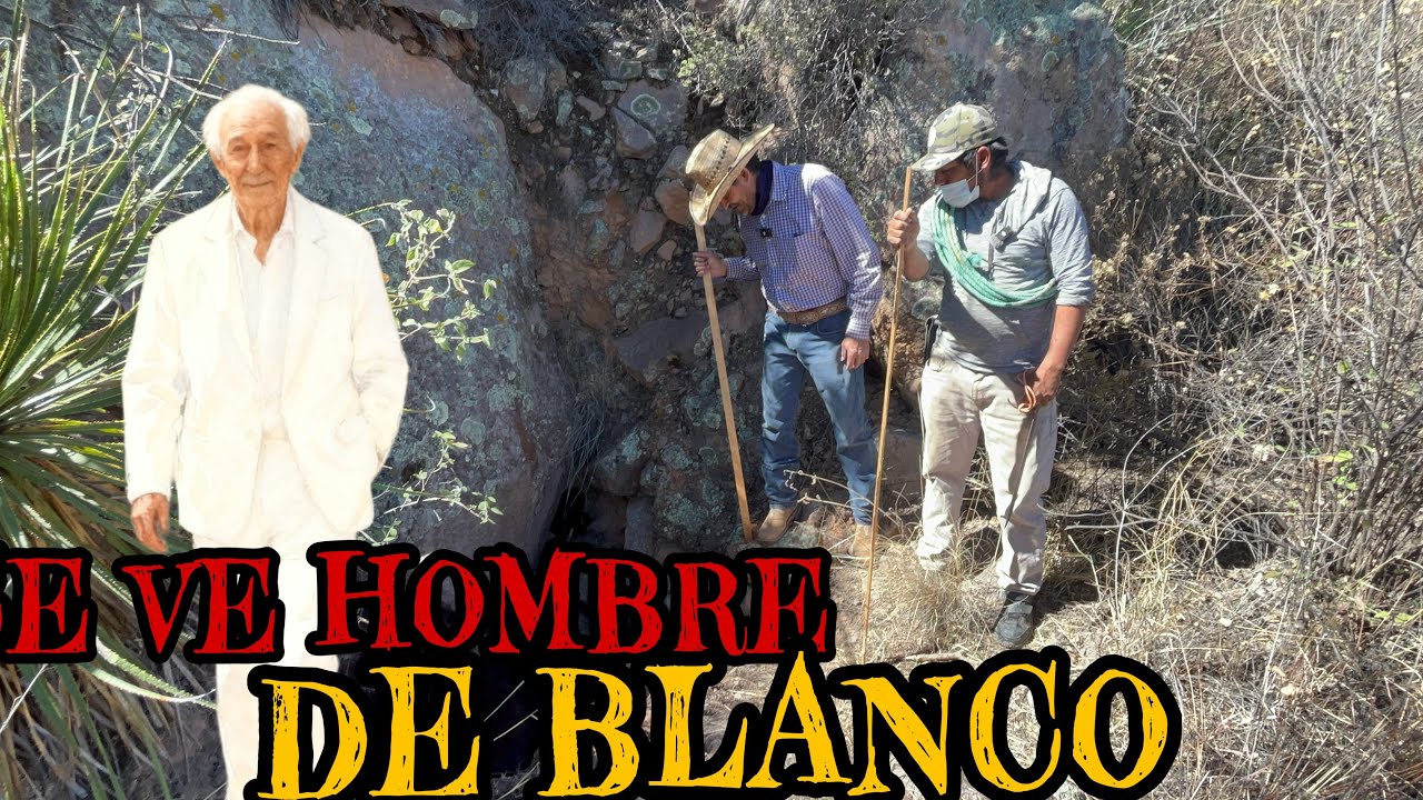 CERCAS DE LA MINA SE VE UN HOMBRE DE BLANCO