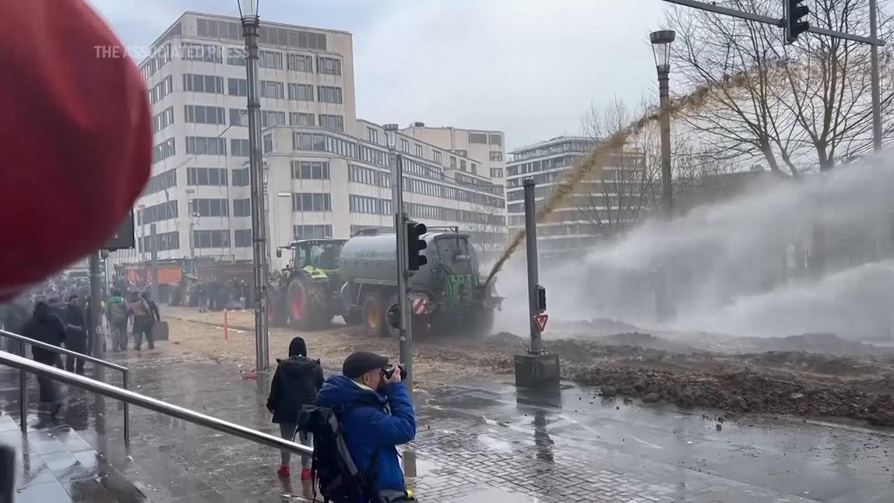 Protesting farmers spray manure at police during demonstration in Brussels