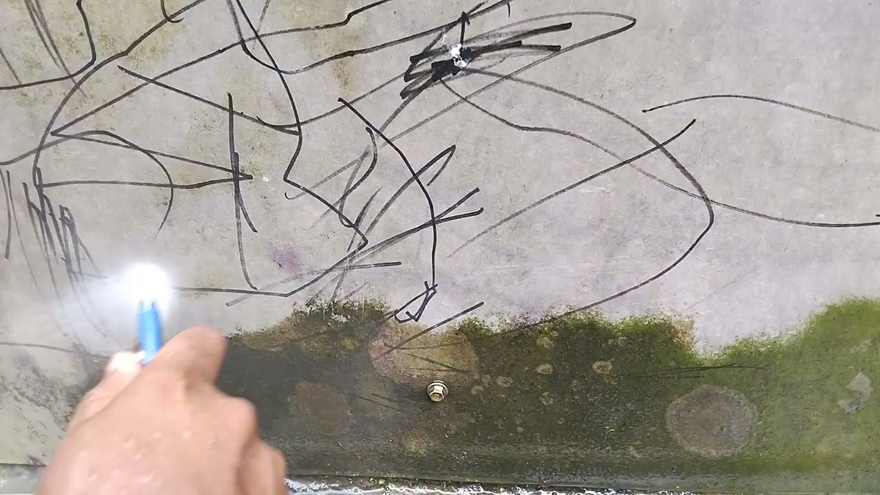 cleaning moss on the GRC wall