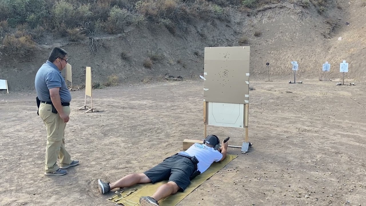 Handgun shooting from a barricade-prone position.