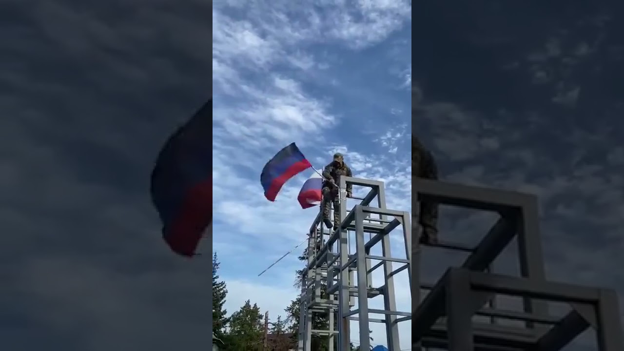 Ukrainian liberator pulls down Russian and so-called puppet 