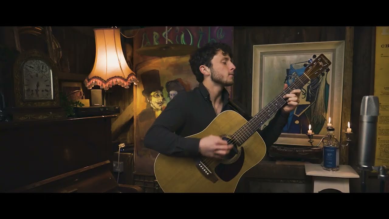 Playing acoustic guitar in a Scottish gin distillery