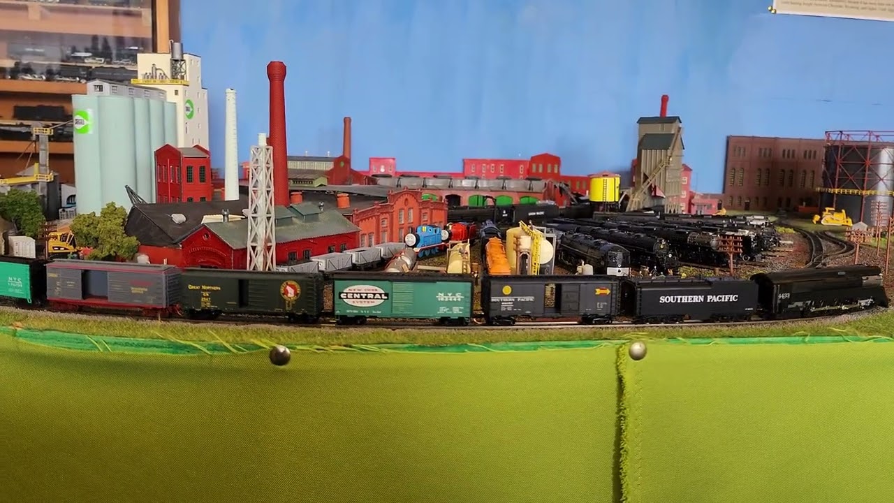 SP #4433 boxcar train passes the roundhouse