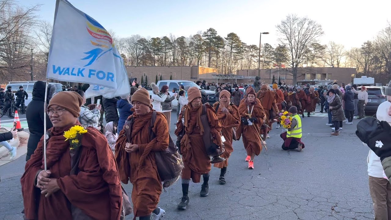 The procession was very long, with many people waiting in the cold weather.
