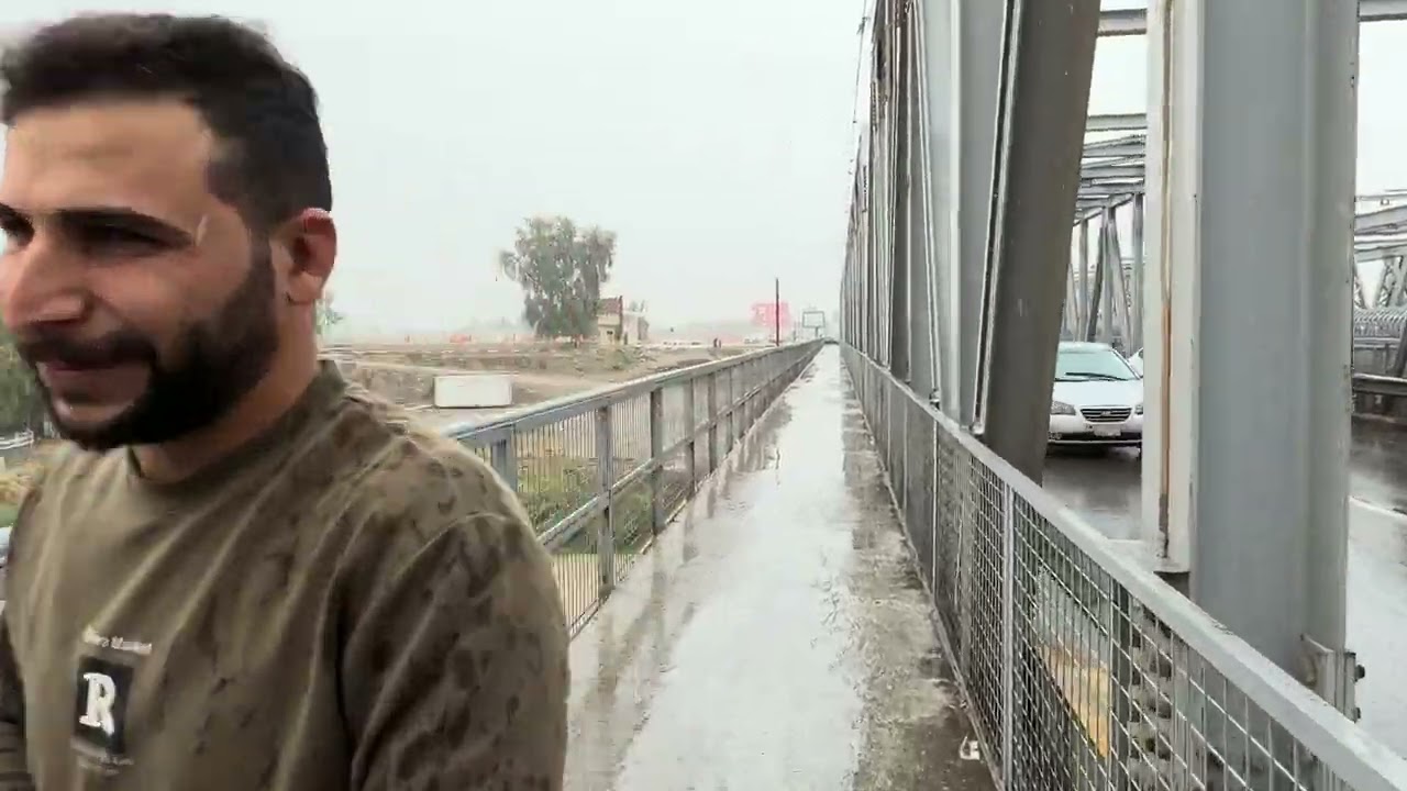 Mosul, the old bridge, in rainy weather ‏مدينة الموصل الجسر عتيق ‏في أجواء ممطرة