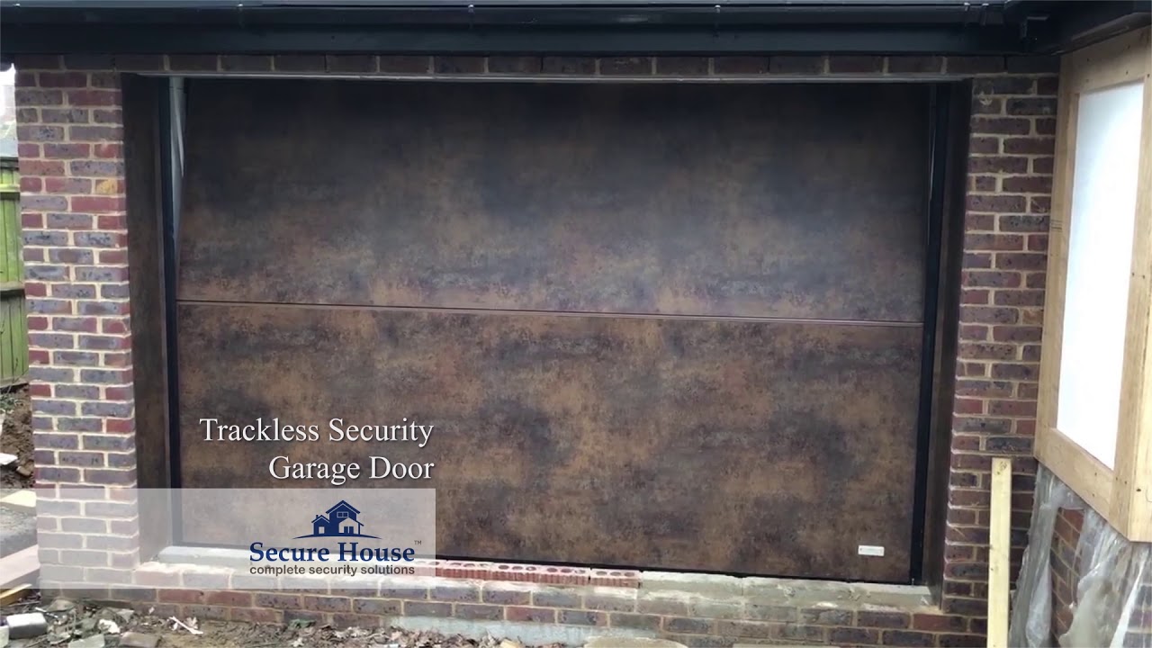 Trackless security garage door