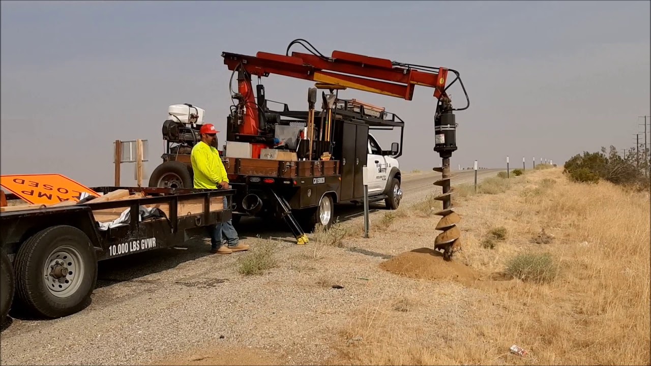 Highway Installation of Road Sign using UtilityWorker Auger by Mojave Industrial Tools to drill hole
