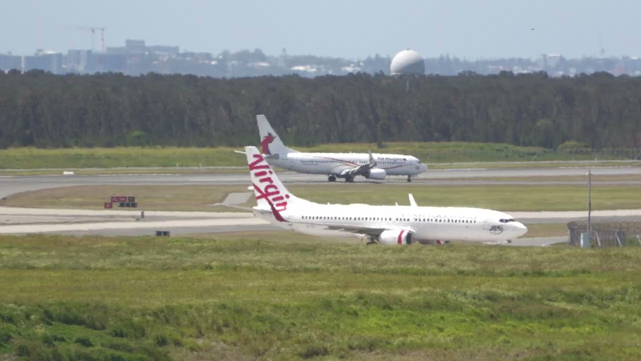 Virgin Australia and Air Nuigini 737-800 landings on the new runway at Brisbane Airport