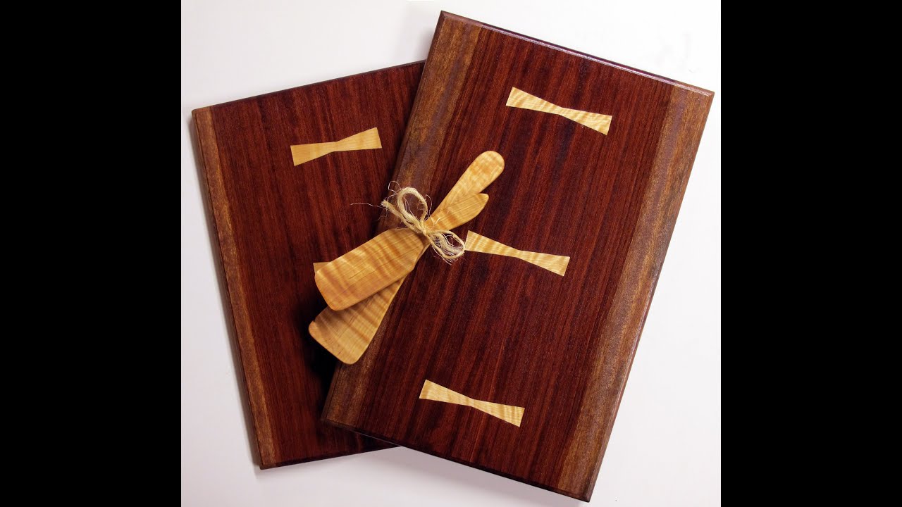 Bookmatched Bubinga breadboard with flamed Birch bowties