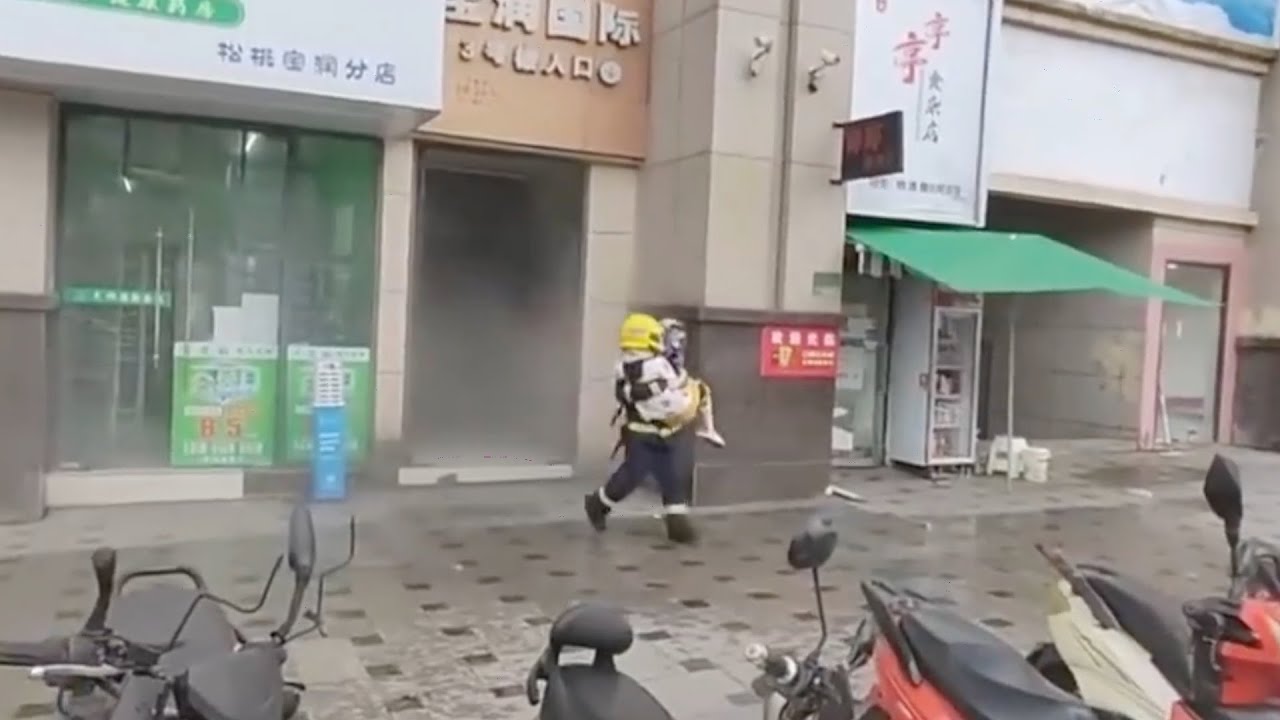 Firefighter retches after sprinting to save girl from burning tower