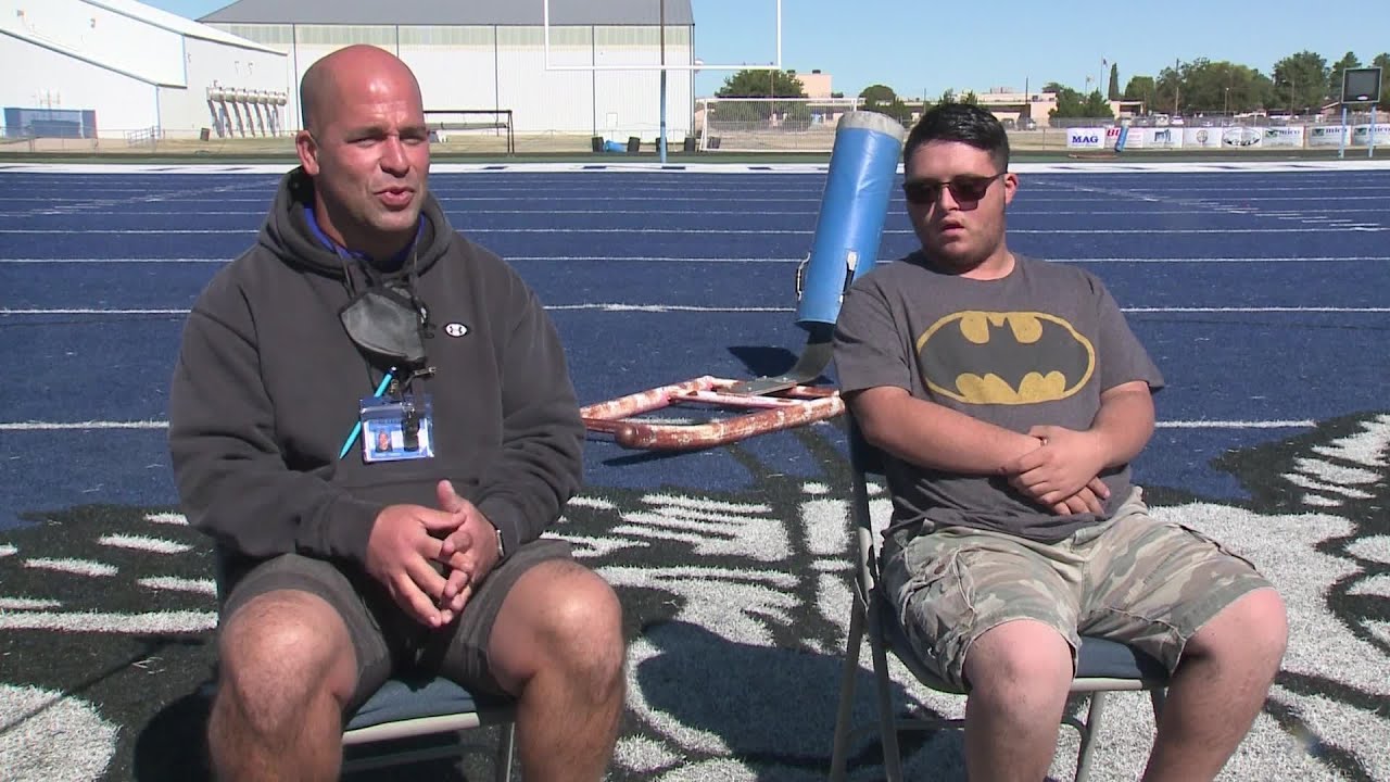 Lovington Football player with Down Syndrome's first touch down in a team celebration
