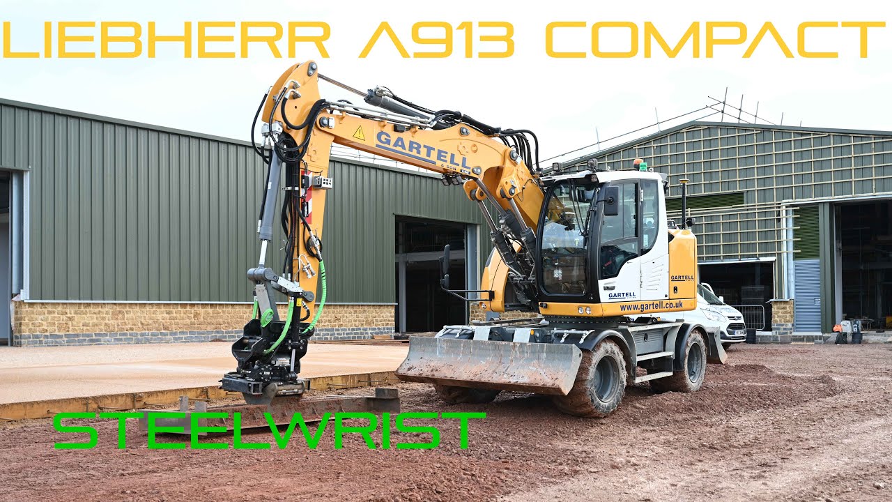 Grading a yard with a Liebherr A913 Compact, Steelwrist grading beam and Leica MC1