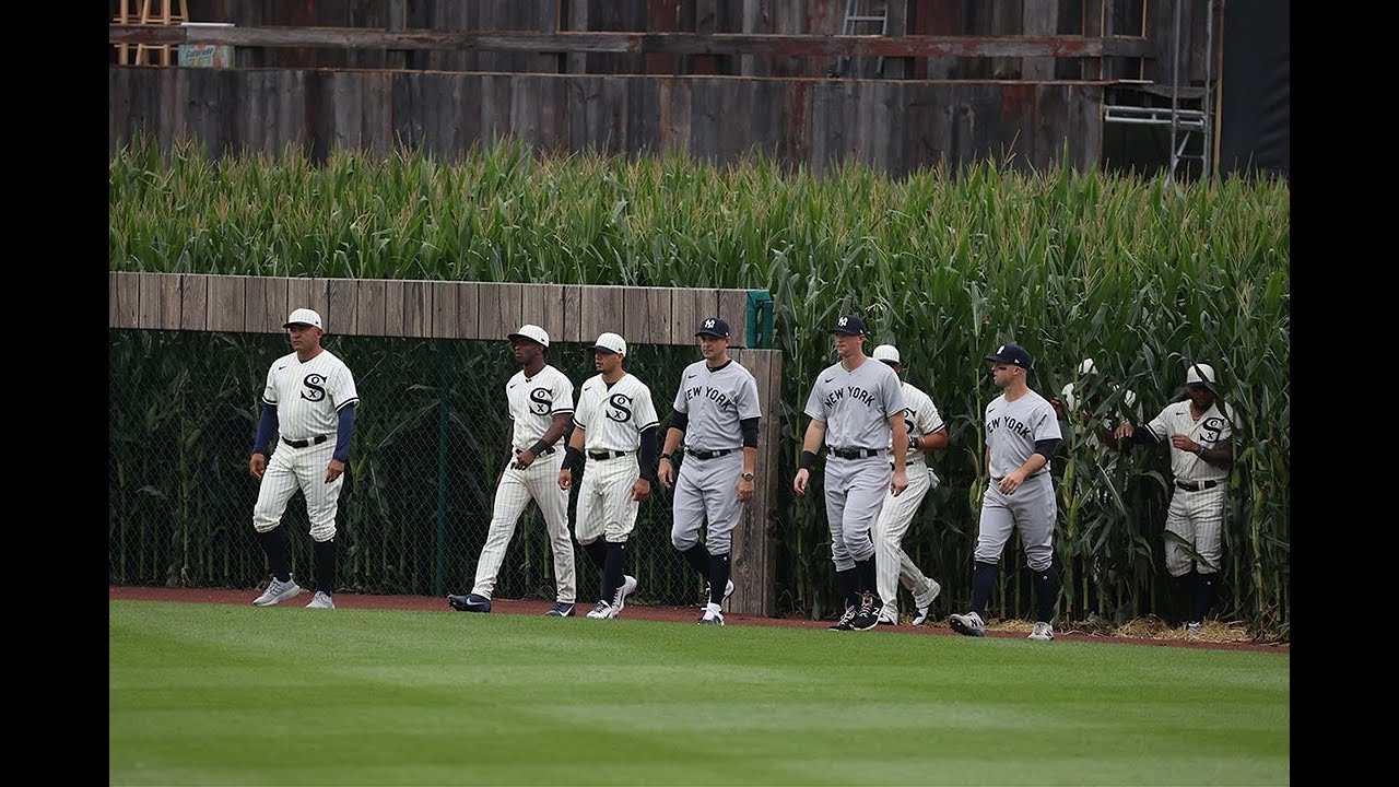 Kevin Costner leads the Yankees and White Sox out of the cornfield at MLB at Field of Dreams!