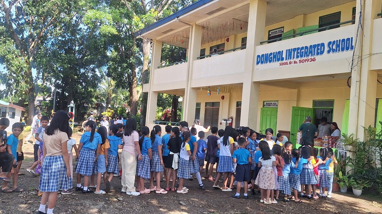 Share of joy.  Giving back pack in kids school