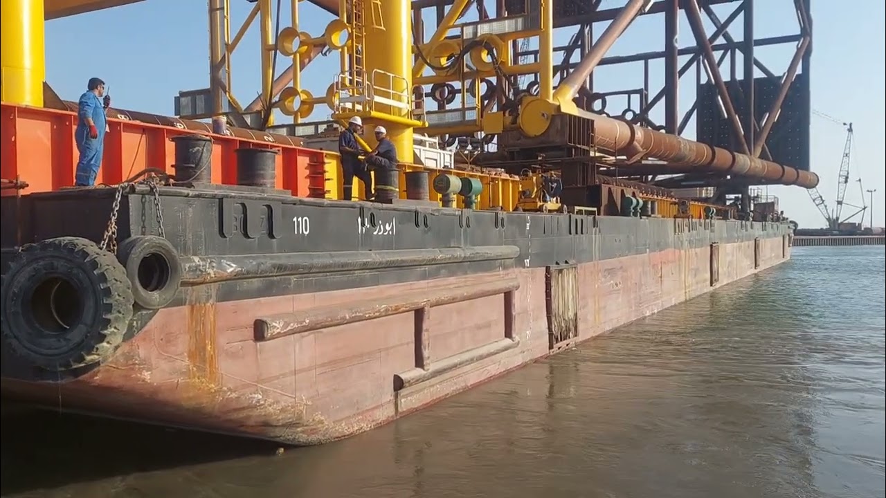 Double the Power: Heavy Barge Tow by Two Mighty Tugboats Demonstrated.