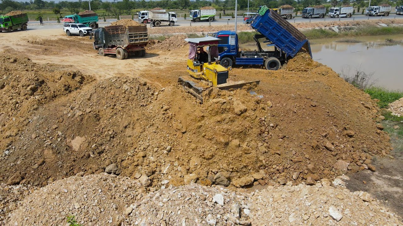 Best Action , Good Job  Showing Team Operator Bulldozer and Dump Truck Moving Soil, Land Filling for