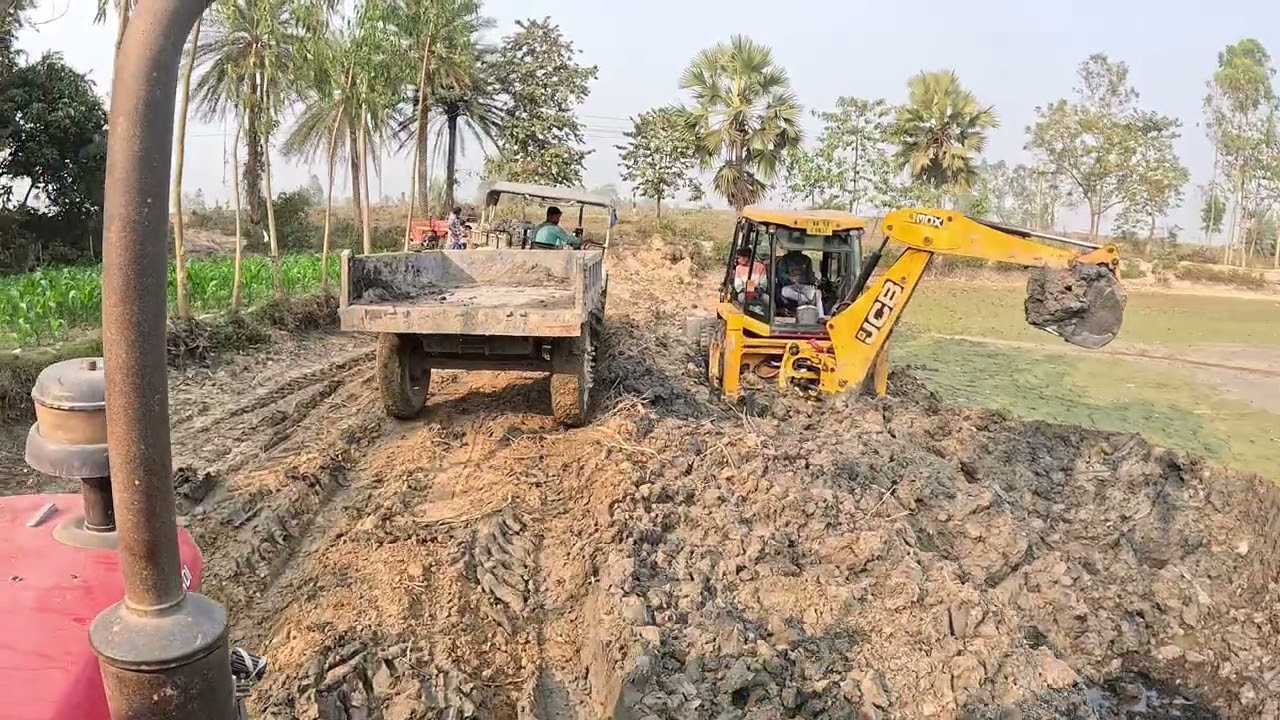 JCB truck is digging the soil in the morning at Toli