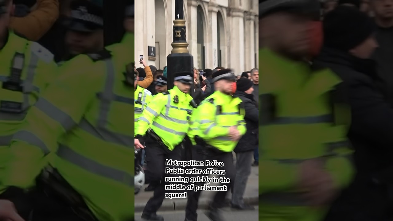 Met Police public order officers running quickly in parliament square during small protest #police