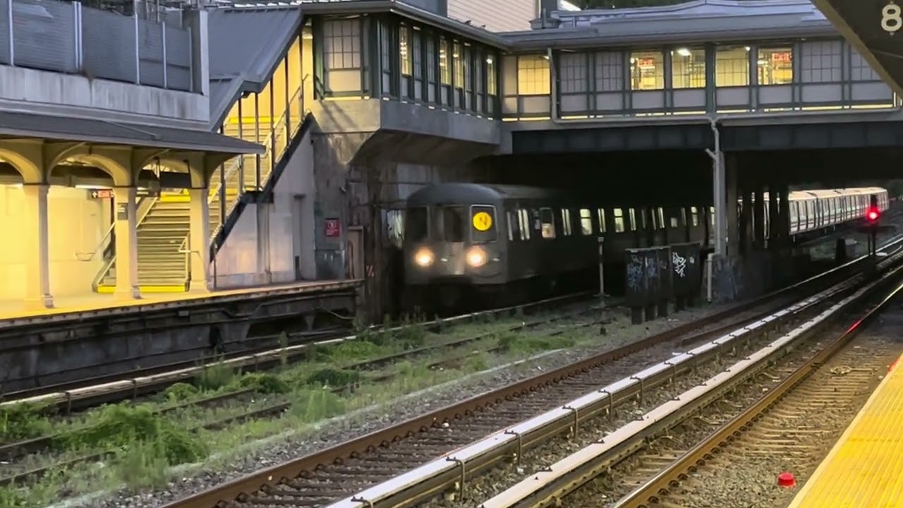 MTA the BMT. N subway trains coming in the Brooklyn Fort Hamilton Parkway station 